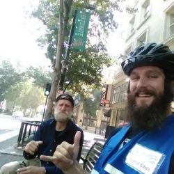 An image of Austin and a homeless man smiling